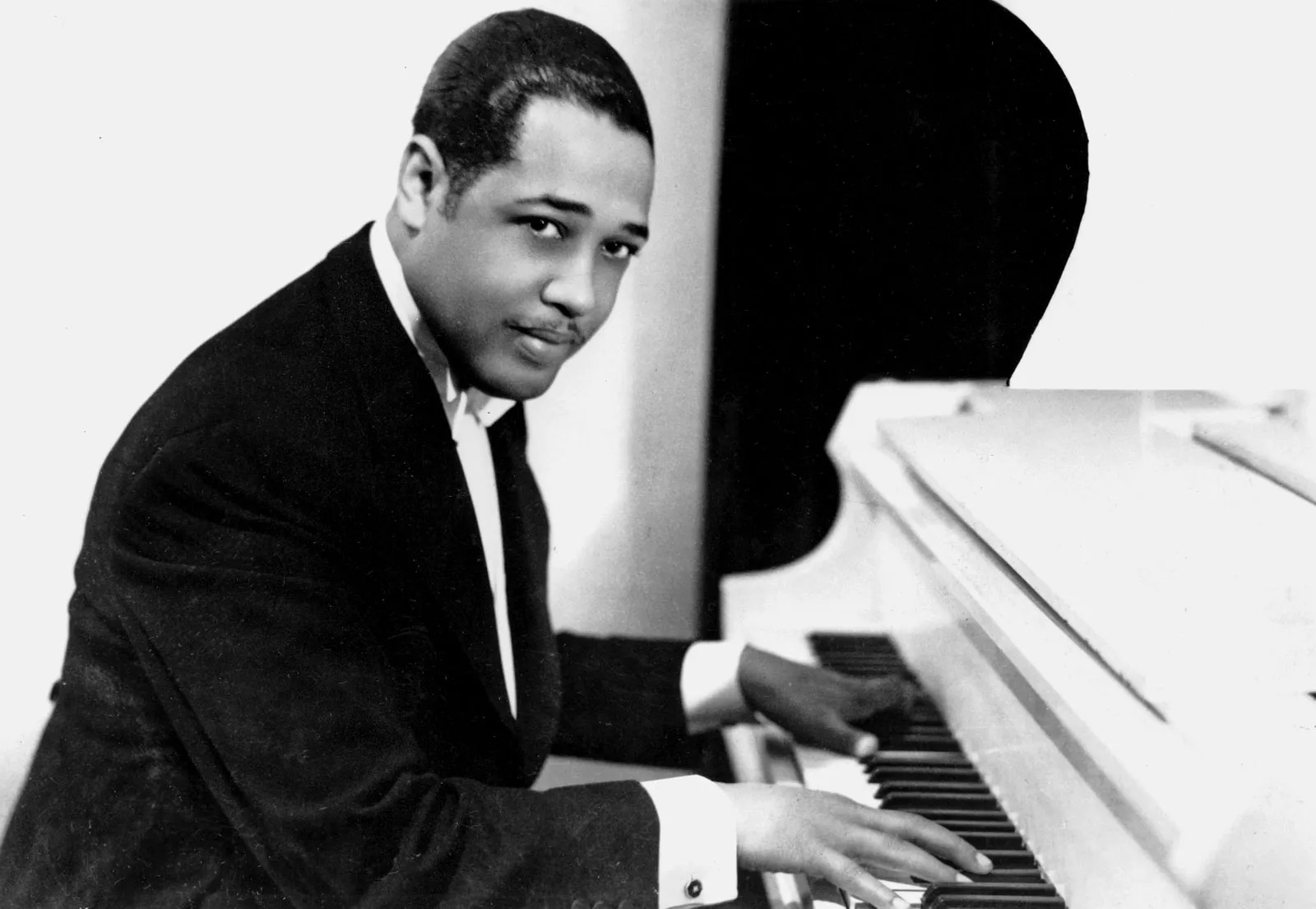 Musician Duke Ellington at the piano