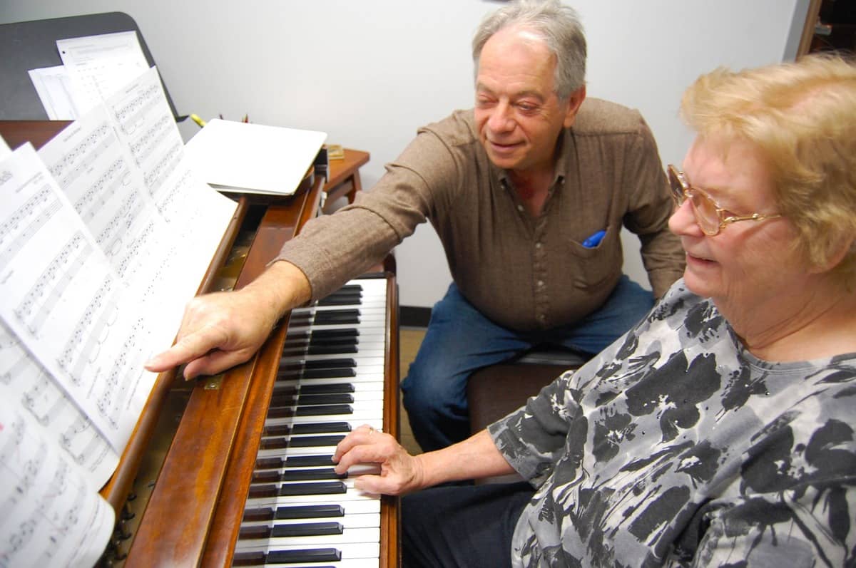 Dennis with his piano student in one of Family Piano's old music lesson studios.
