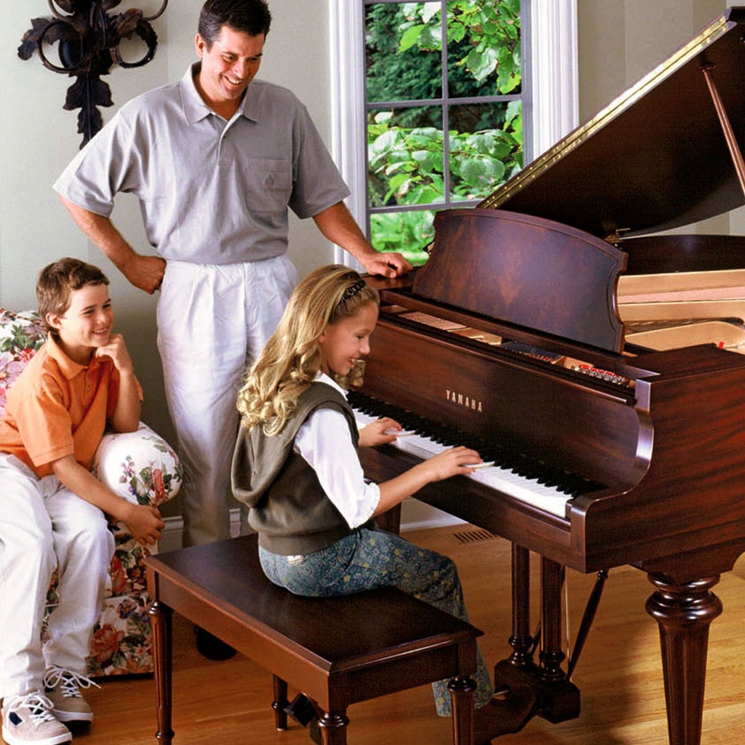 Yamaha Grand Piano Played by a Family in Home