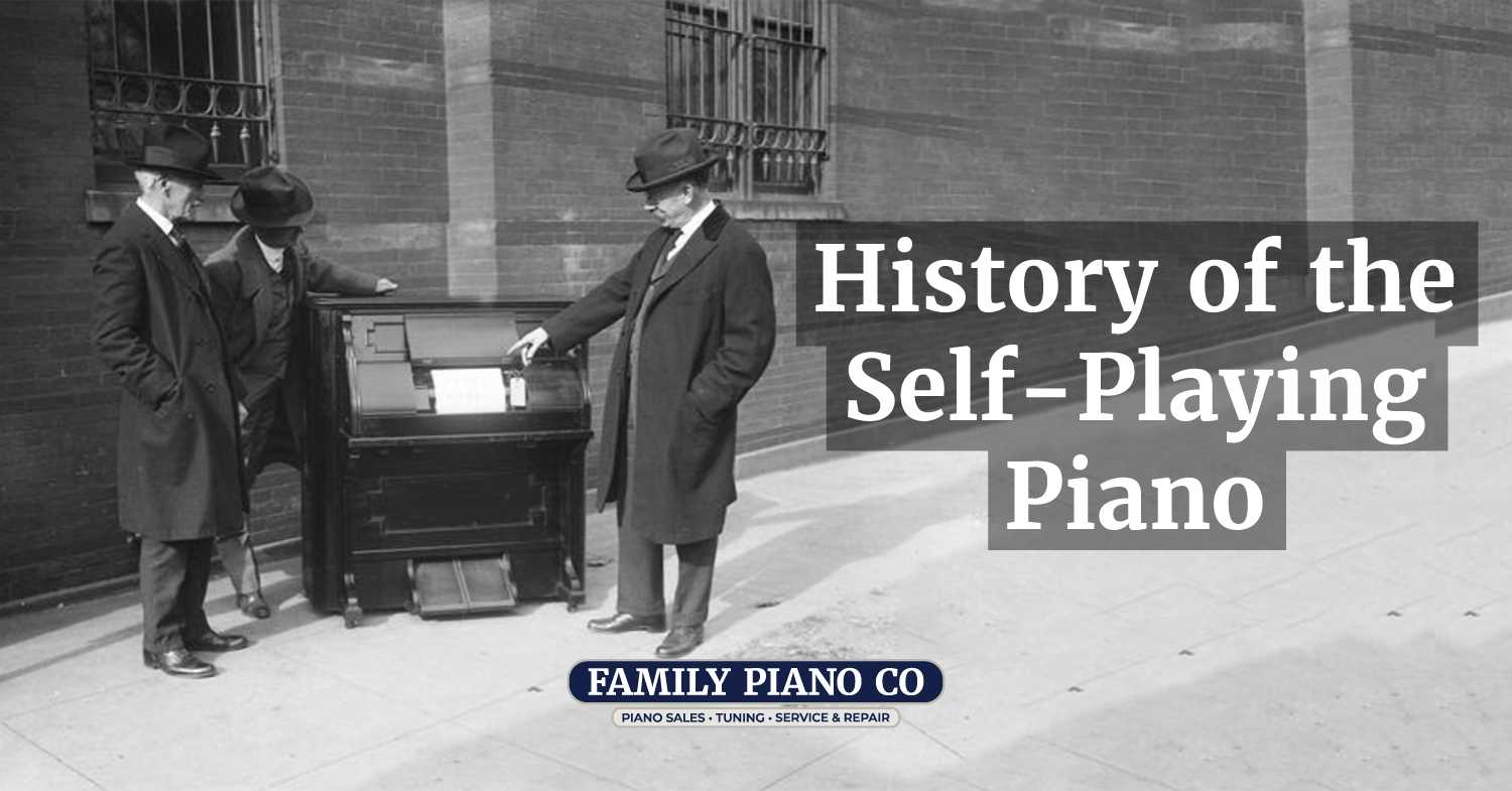 History of the Self-Playing Piano - Three men inspecting a pianola. The photo is in black and white.